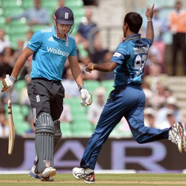 Congleton Guardian: Nuwan Kulasekera, right, celebrates taking the wicket of England captain Alastair Cook Congleton Guardian: Nuwan Kulasekera, right, celebrates taking the wicket of England captain Alastair Cook