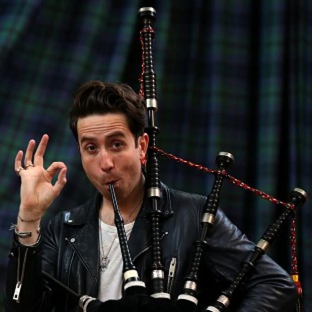 Congleton Guardian: Radio 1 breakfast show host Nick Grimshaw is taught how to play the bagpipes at The National Piping Centre in Glasgow by Finlay MacDonald ahead of the Radio 1 Big weekend Congleton Guardian: Radio 1 breakfast show host Nick Grimshaw is taught how to play the bagpipes at The National Piping Centre in Glasgow by Finlay MacDonald ahead of the Radio 1 Big weekend