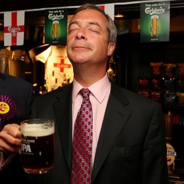 Congleton Guardian: Ukip leader Nigel Farage enjoys a pint in the Hoy and Helmet pub in South Benfleet, Essex, as his party makes election gains Congleton Guardian: Ukip leader Nigel Farage enjoys a pint in the Hoy and Helmet pub in South Benfleet, Essex, as his party makes election gains