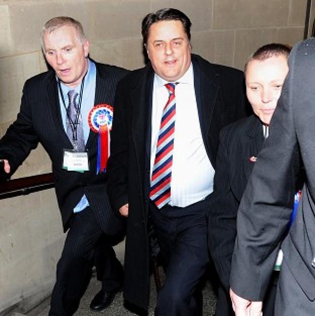 Congleton Guardian: BNP leader Nick Griffin (centre) arrives at the European Parliamentary elections count at Manchester Town Hall Congleton Guardian: BNP leader Nick Griffin (centre) arrives at the European Parliamentary elections count at Manchester Town Hall
