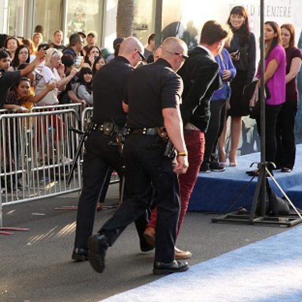 Congleton Guardian: A fan is led away at the world premiere of Maleficent at the El Capitan Theatre in Los Angeles (Matt Sayles/Invision/AP) Congleton Guardian: A fan is led away at the world premiere of Maleficent at the El Capitan Theatre in Los Angeles (Matt Sayles/Invision/AP)