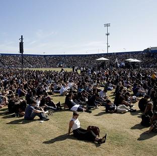 Congleton Guardian: The crowd listens during a memorial service for the victims and families of Friday's rampage at Harder Stadium on the campus of University of California, Santa Barbara Congleton Guardian: The crowd listens during a memorial service for the victims and families of Friday's rampage at Harder Stadium on the campus of University of California, Santa Barbara