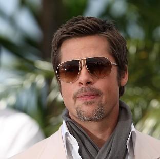 Congleton Guardian: A man arrested after jostling with Brad Pitt on a red carpet claims he was trying to give the actor a hug Congleton Guardian: A man arrested after jostling with Brad Pitt on a red carpet claims he was trying to give the actor a hug