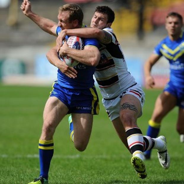 Congleton Guardian: Michael Monaghan, pictured being tackled by Bradford's Jay Pitts, suffered an injury in Warrington's semi-final win Congleton Guardian: Michael Monaghan, pictured being tackled by Bradford's Jay Pitts, suffered an injury in Warrington's semi-final win