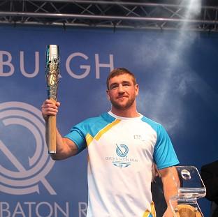 Congleton Guardian: Alex Arthur carried the Glasgow 2014 Queen's Baton on to the stage as it ended the day in Edinburgh (David Cheskin for Glasgow 2014) Congleton Guardian: Alex Arthur carried the Glasgow 2014 Queen's Baton on to the stage as it ended the day in Edinburgh (David Cheskin for Glasgow 2014)