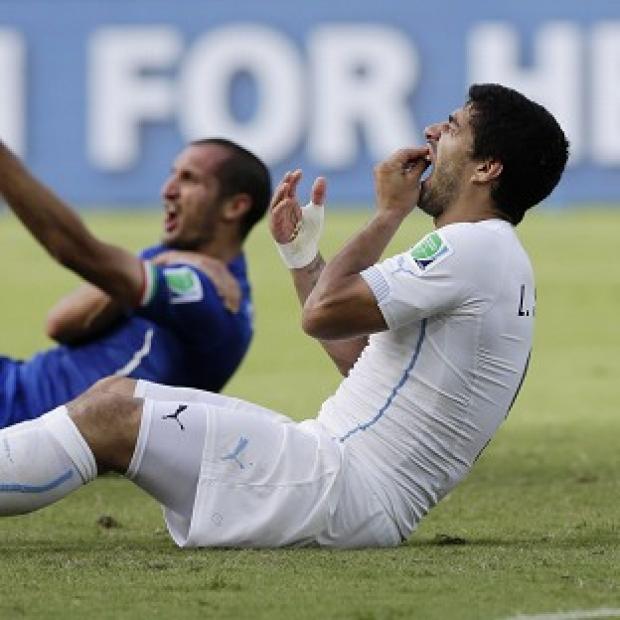 Congleton Guardian: Luis Suarez, right, will miss four months of football through suspension (AP) Congleton Guardian: Luis Suarez, right, will miss four months of football through suspension (AP)