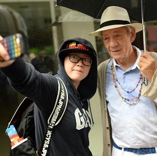 Congleton Guardian: Sir Ian McKellan poses for a selfie with a reveller at the Pride in London Parade Congleton Guardian: Sir Ian McKellan poses for a selfie with a reveller at the Pride in London Parade