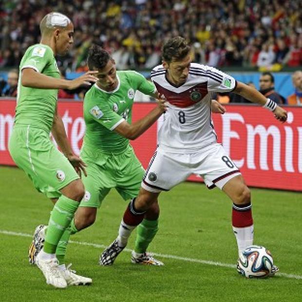 Congleton Guardian: Mesut Ozil, right, scored the decisive goal on a tough night for Germany against Algeria (AP) Congleton Guardian: Mesut Ozil, right, scored the decisive goal on a tough night for Germany against Algeria (AP)