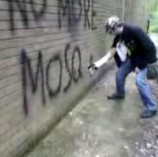 Congleton Guardian: Handout stills shown to the jury in the Old Bailey trial of Michael Piggin showing the teenager spraying anti-Muslim graffiti Congleton Guardian: Handout stills shown to the jury in the Old Bailey trial of Michael Piggin showing the teenager spraying anti-Muslim graffiti
