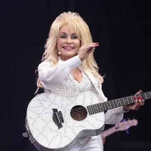 Congleton Guardian: Dolly Parton performing on the Pyramid Stage at the Glastonbury Festival, at Worthy Farm in Somerset. Congleton Guardian: Dolly Parton performing on the Pyramid Stage at the Glastonbury Festival, at Worthy Farm in Somerset.