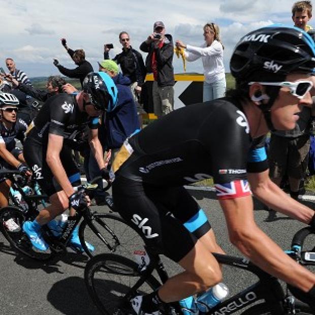 Congleton Guardian: Chris Froome, centre, injured his wrist in a crash on stage four Congleton Guardian: Chris Froome, centre, injured his wrist in a crash on stage four