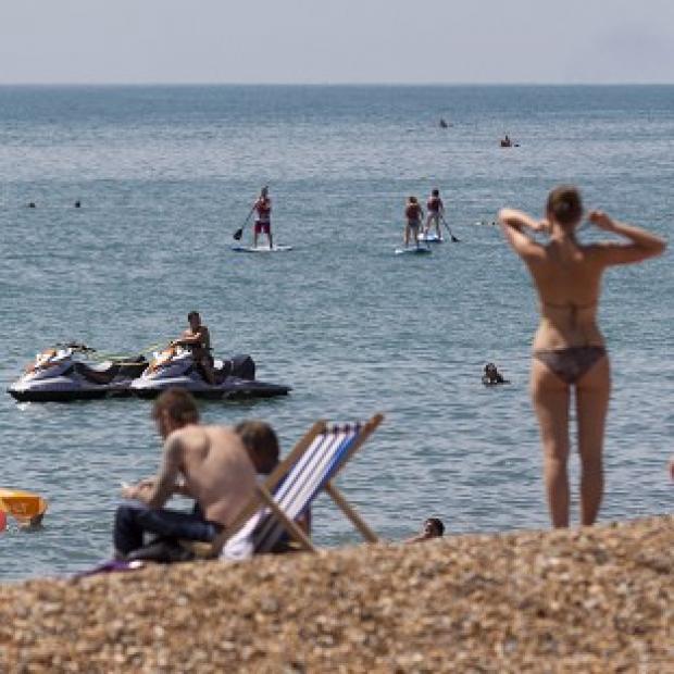 Congleton Guardian: People flock to the beach in Brighton, East Sussex, as temperatures soar Congleton Guardian: People flock to the beach in Brighton, East Sussex, as temperatures soar
